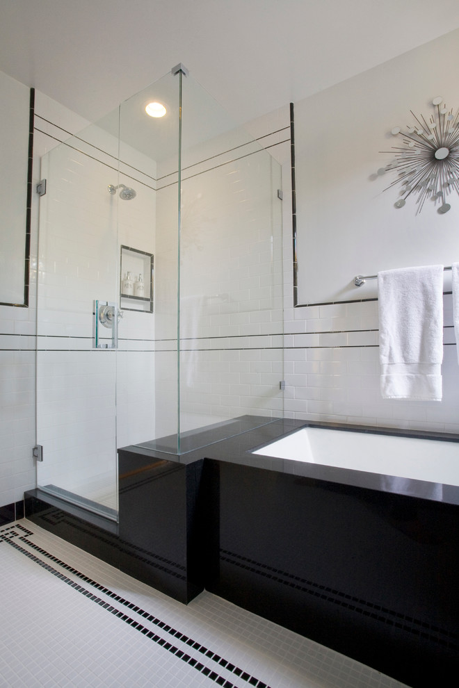 This is an example of a large transitional master bathroom in Los Angeles with an undermount sink, shaker cabinets, white cabinets, soapstone benchtops, a drop-in tub, a corner shower, white tile, subway tile, white walls and mosaic tile floors.