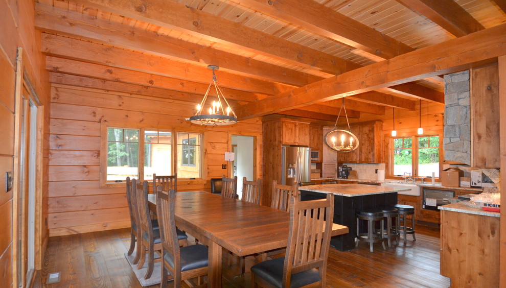 This is an example of a mid-sized country open plan dining in Other with brown walls, medium hardwood floors and no fireplace.