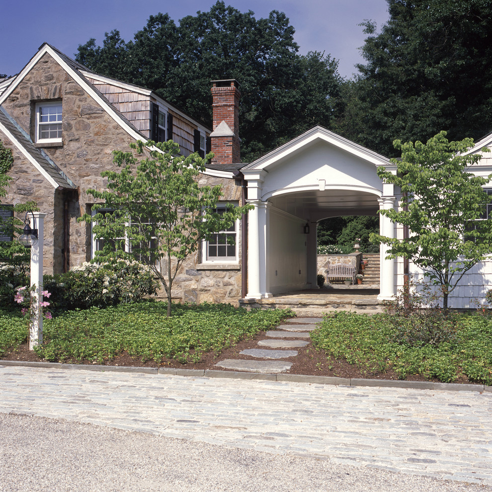 Small country two-storey exterior in New York with stone veneer.