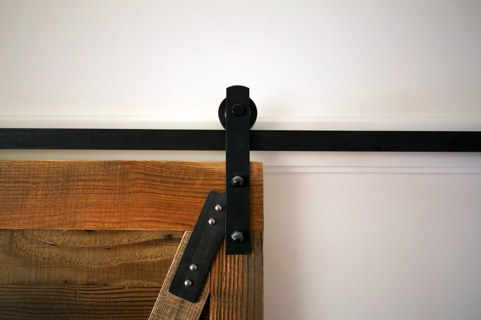 Mid-sized mountain style medium tone wood floor hallway photo in Vancouver with white walls