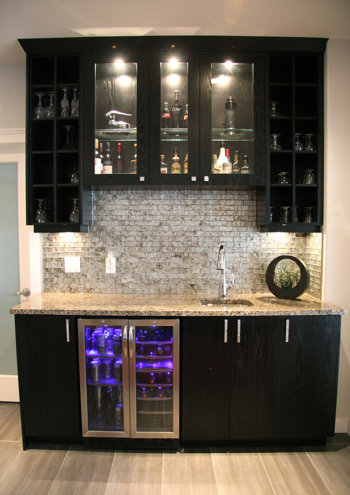 This is an example of a small contemporary single-wall wet bar in Other with an undermount sink, flat-panel cabinets, black cabinets, granite benchtops, beige splashback, stone tile splashback and ceramic floors.
