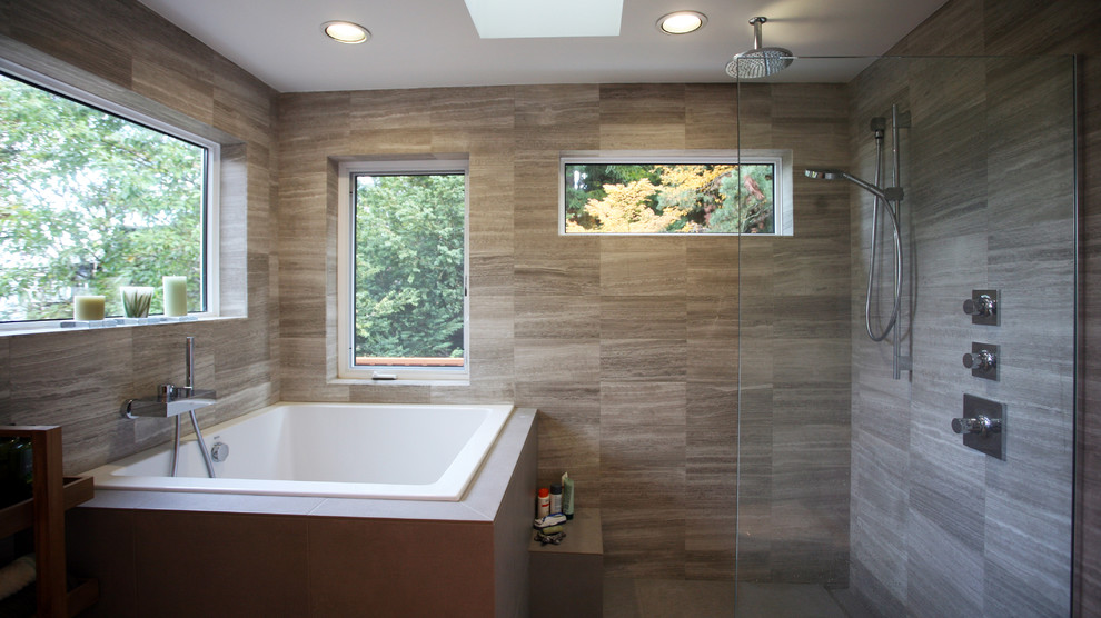 This is an example of a large contemporary master bathroom in Portland with a corner tub and an open shower.