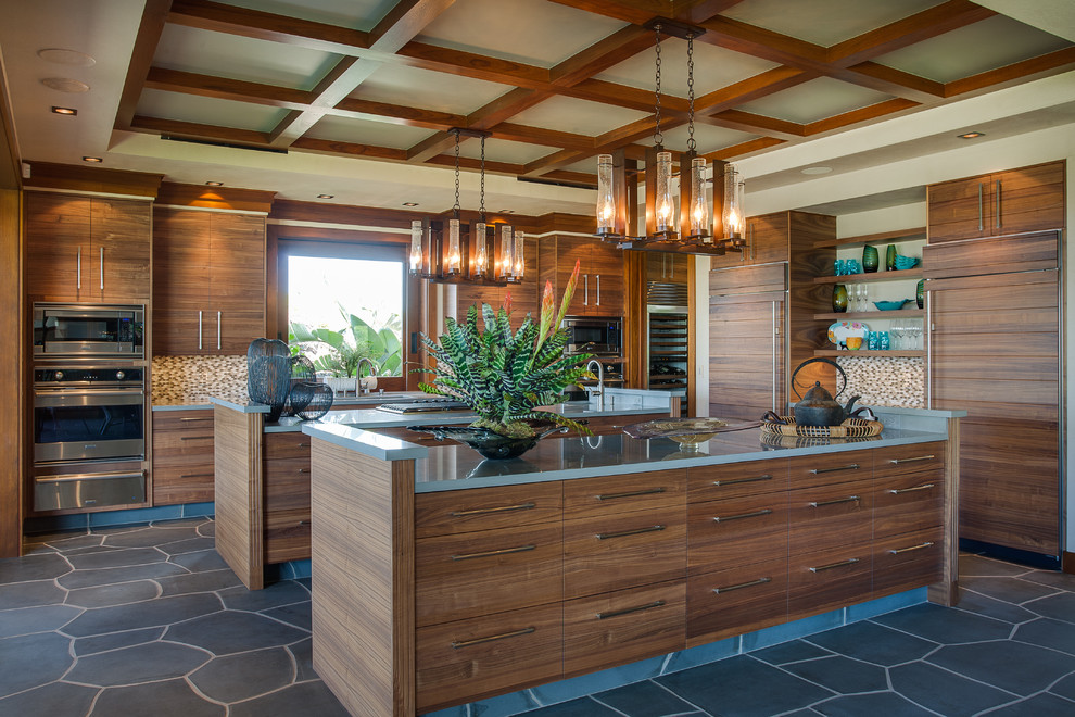 Inspiration for a tropical kitchen in Vancouver with panelled appliances.
