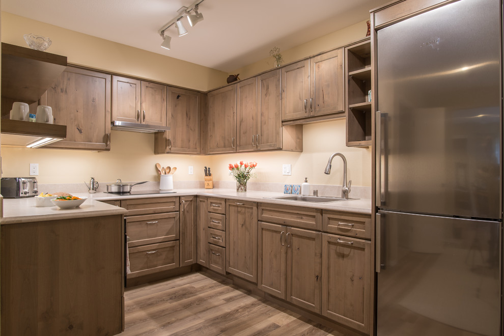 Example of a transitional kitchen design in Seattle with yellow walls