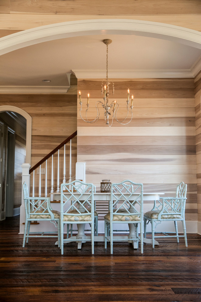Inspiration for a traditional dining room in Raleigh with dark hardwood floors.