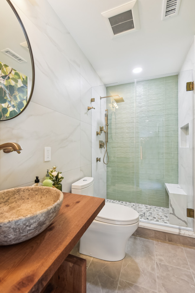 Inspiration for a small country 3/4 bathroom in DC Metro with open cabinets, brown cabinets, an alcove shower, beige tile, ceramic tile, cement tiles, a vessel sink, wood benchtops, a hinged shower door, a single vanity and a floating vanity.