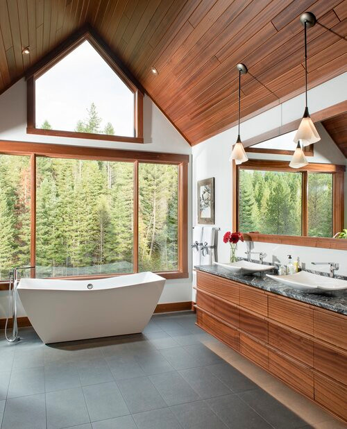 Large contemporary master bathroom in Other with flat-panel cabinets, a freestanding tub, a double shower, a one-piece toilet, multi-coloured walls, slate floors, a vessel sink, granite benchtops, black floor, a hinged shower door, grey benchtops, a shower seat, a double vanity, a floating vanity and wood.