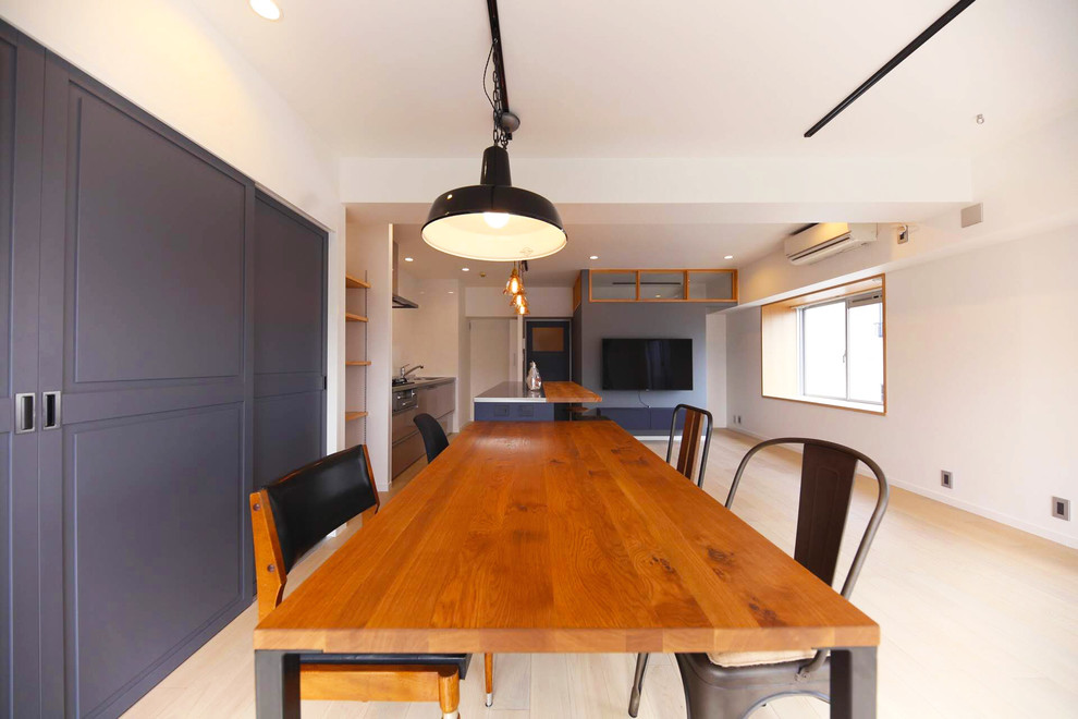 Inspiration for a large scandinavian open plan dining in Nagoya with blue walls, light hardwood floors and white floor.