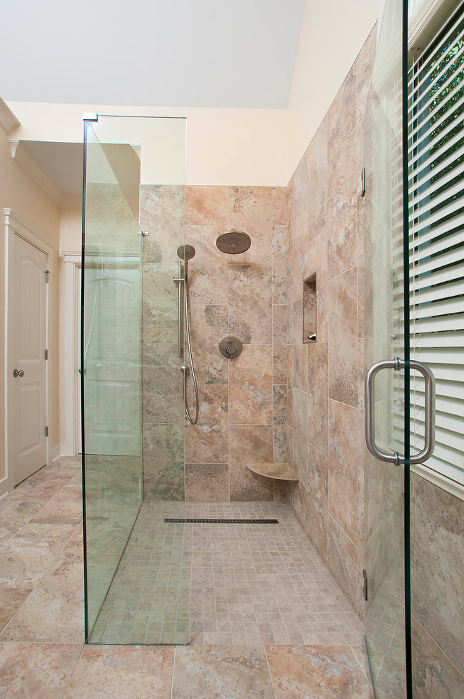 Mid-sized transitional master bathroom in Atlanta with a curbless shower, brown tile, porcelain tile, porcelain floors, brown floor and a hinged shower door.