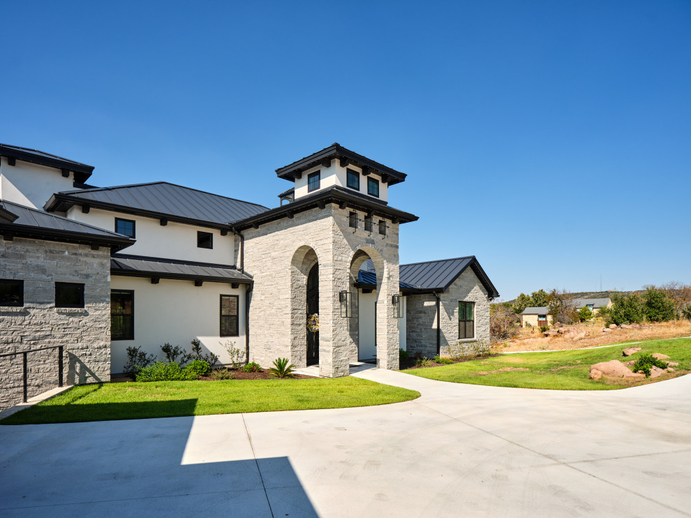 Example of a huge trendy exterior home design in Austin