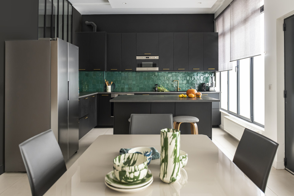 Photo of a large contemporary l-shaped eat-in kitchen in Paris with a drop-in sink, beaded inset cabinets, black cabinets, laminate benchtops, green splashback, ceramic splashback, stainless steel appliances, ceramic floors, with island, beige floor and grey benchtop.