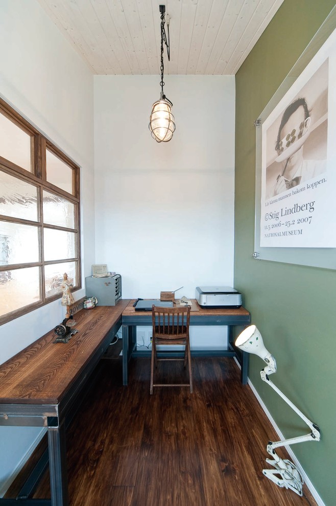 Design ideas for a small industrial home office in Nagoya with green walls, dark hardwood floors and a freestanding desk.