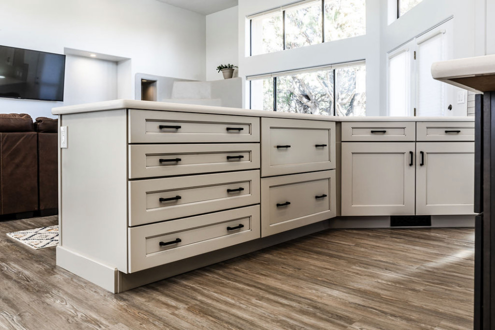 Inspiration for a large transitional u-shaped vinyl floor and gray floor eat-in kitchen remodel with an undermount sink, shaker cabinets, gray cabinets, quartzite countertops, green backsplash, subway tile backsplash, stainless steel appliances, an island and white countertops