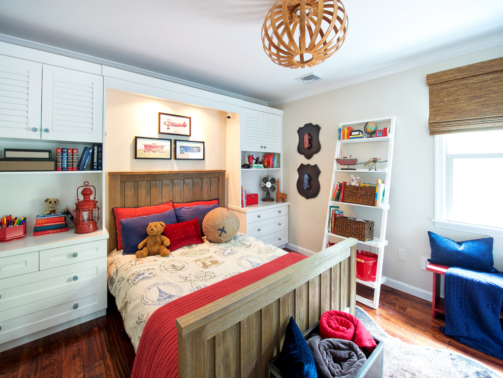 Inspiration for a mid-sized transitional kids' room for boys in New York with beige walls and medium hardwood floors.