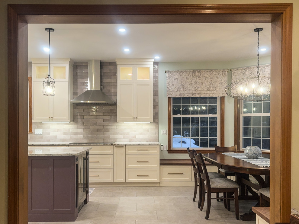 Example of a large transitional u-shaped porcelain tile and beige floor eat-in kitchen design in Bridgeport with recessed-panel cabinets, purple cabinets, granite countertops, subway tile backsplash, an island, white countertops, an undermount sink and multicolored backsplash