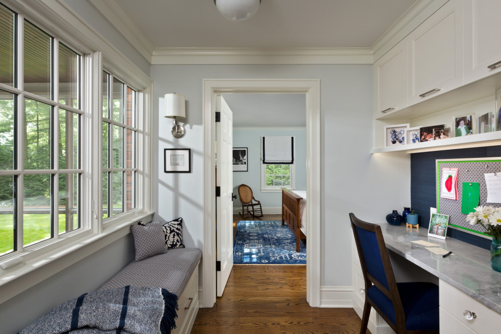 Photo of a large traditional hallway in Boston with blue walls, medium hardwood floors and brown floor.