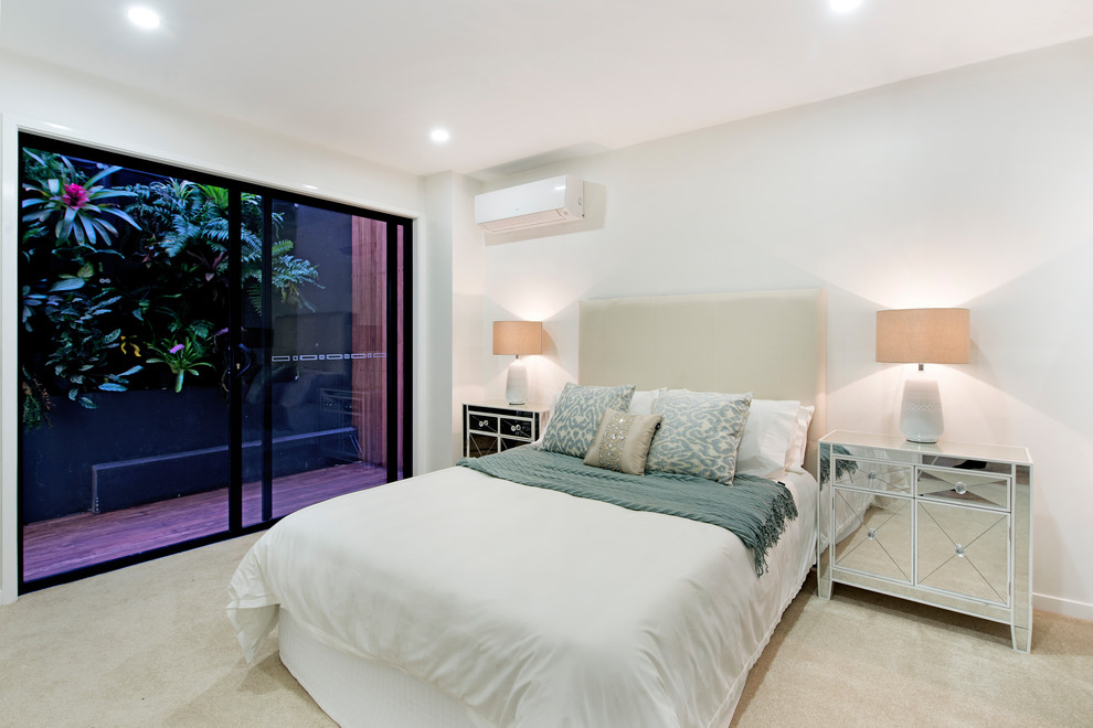 Inspiration for a contemporary bedroom in Brisbane with white walls, carpet and beige floor.