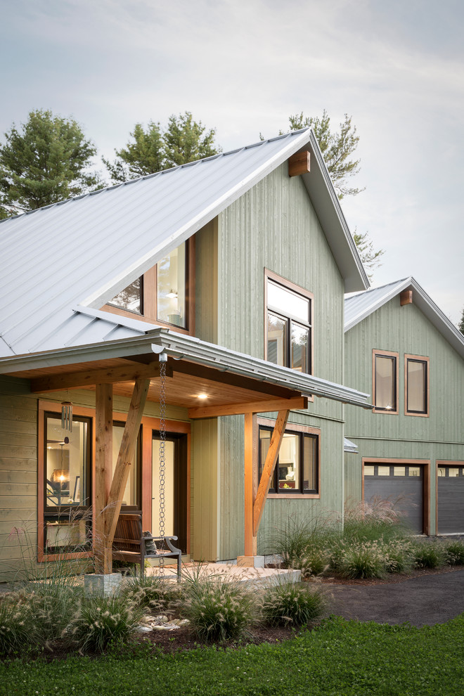 Photo of a contemporary exterior in Portland Maine with wood siding.