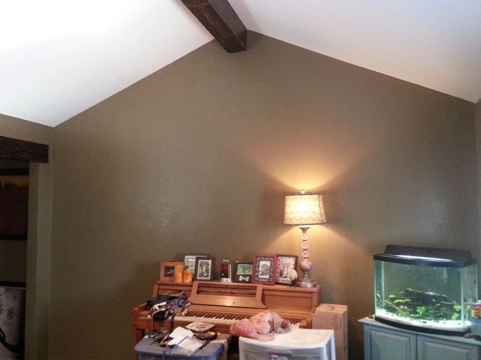 What to do with blank wall with cathedral ceiling in my living room