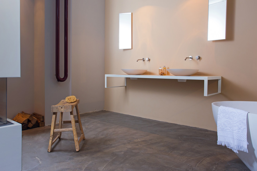 This is an example of a mid-sized modern master bathroom in Amsterdam with a freestanding tub.