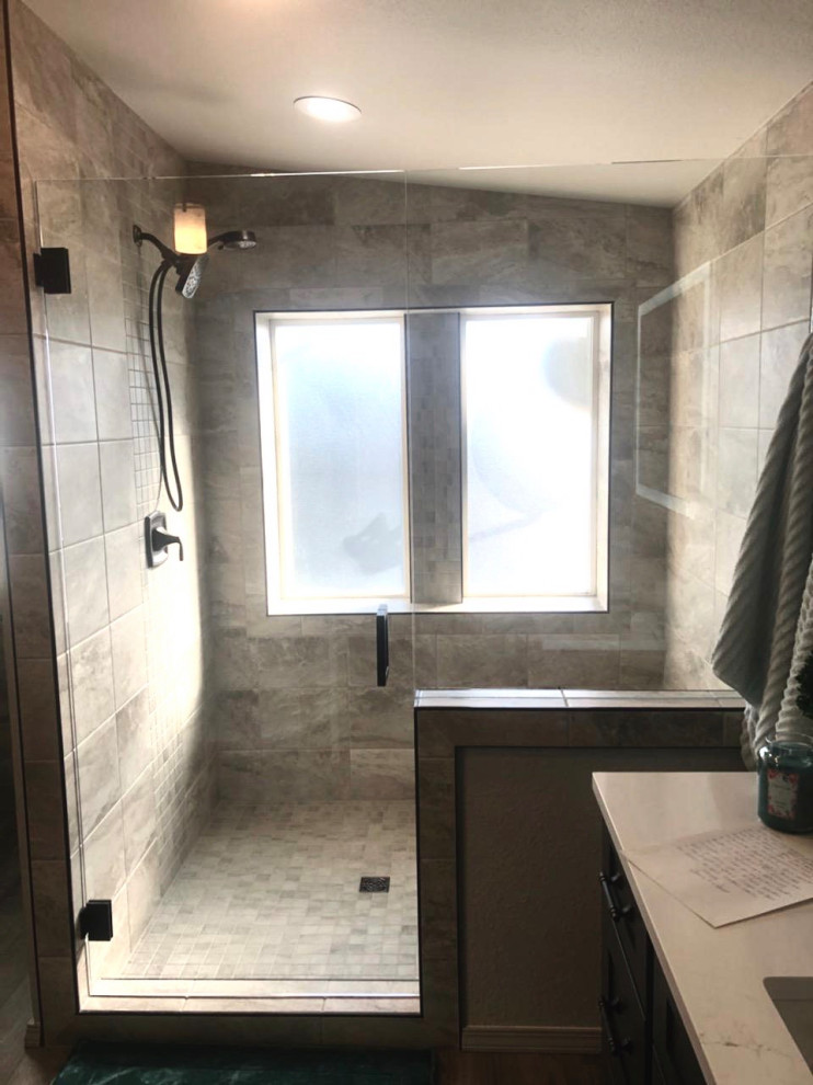 Mid-sized contemporary master bathroom in Other with shaker cabinets, dark wood cabinets, porcelain tile, grey walls, vinyl floors, an undermount sink, engineered quartz benchtops, a hinged shower door, white benchtops, a shower seat, a double vanity and a built-in vanity.
