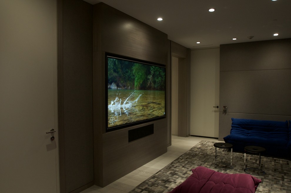 Photo of a mid-sized modern enclosed home theatre in Miami with brown walls, carpet and a built-in media wall.