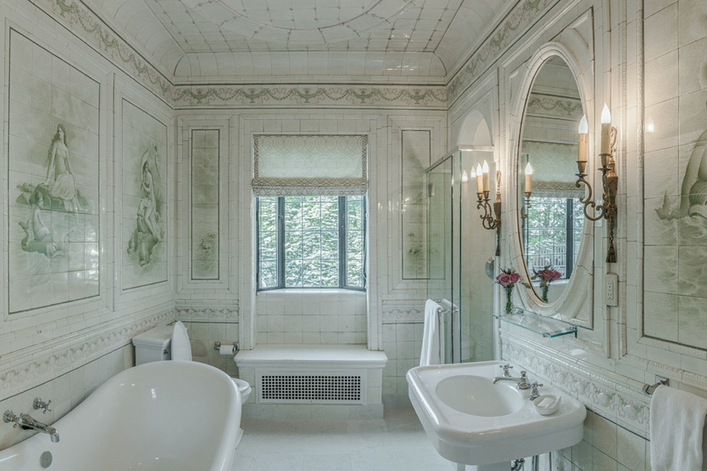 Photo of a large traditional bathroom in Providence with a pedestal sink, a freestanding tub, an alcove shower, a two-piece toilet, white tile, ceramic tile, white walls and limestone floors.