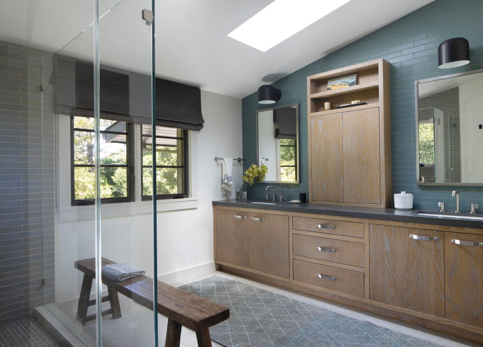 Design ideas for a transitional master bathroom in San Francisco with flat-panel cabinets, medium wood cabinets, an alcove shower, blue tile, subway tile, an undermount sink, engineered quartz benchtops, white floor, black benchtops, a double vanity, a built-in vanity and vaulted.