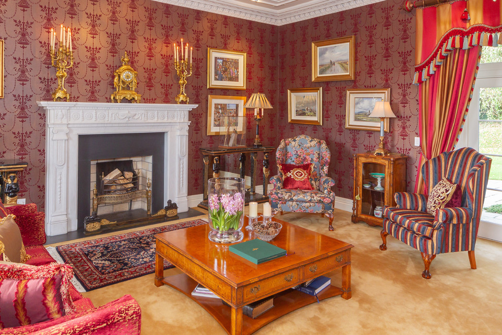 Traditional formal living room in Belfast with red walls, carpet, a standard fireplace and beige floor.
