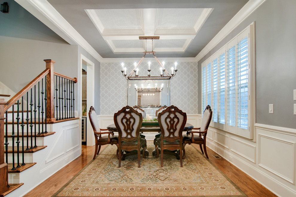 Inspiration for a small traditional dining room in Nashville with grey walls and medium hardwood floors.