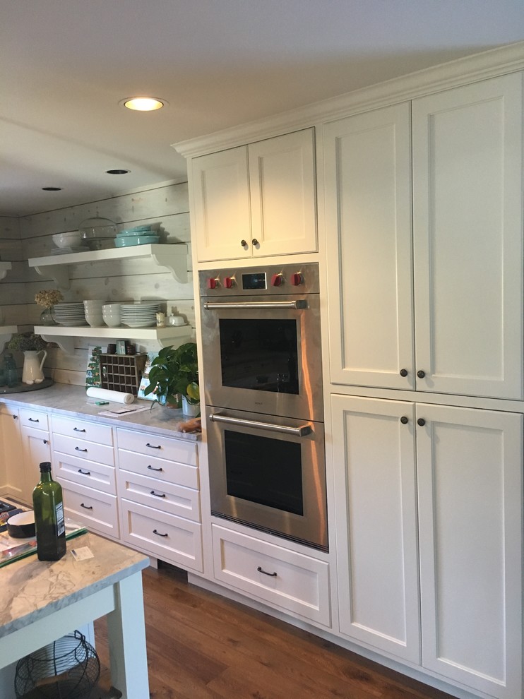 Example of a transitional kitchen design in Denver
