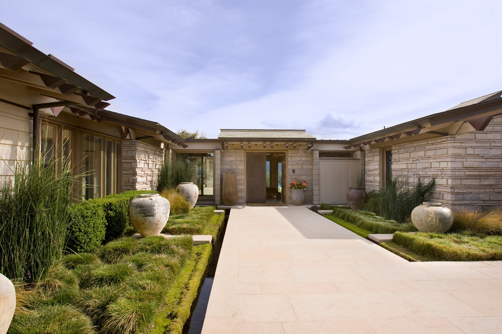 Photo of a contemporary one-storey exterior in San Francisco with stone veneer.