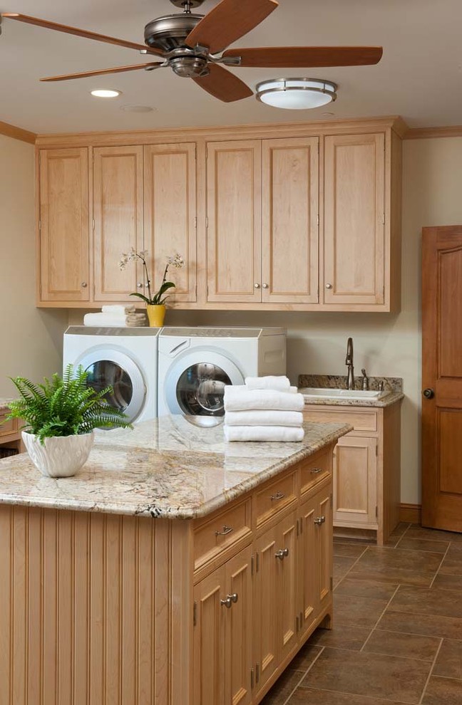Photo of a traditional laundry room in Burlington with a drop-in sink.