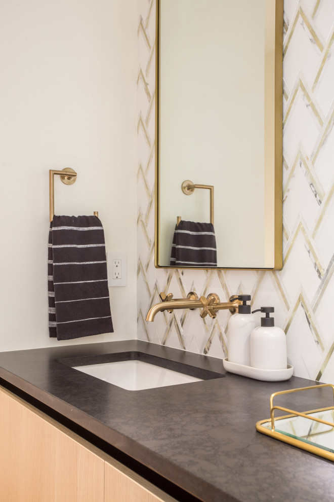 Photo of a medium sized modern cloakroom in Seattle with flat-panel cabinets, light wood cabinets, a one-piece toilet, yellow tiles, marble tiles, white walls, light hardwood flooring, a submerged sink, engineered stone worktops, brown floors, black worktops and a built in vanity unit.