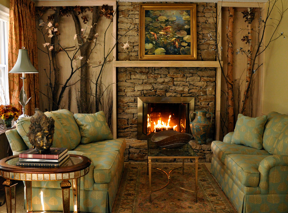 This is an example of a traditional living room in Kansas City with a stone fireplace surround.