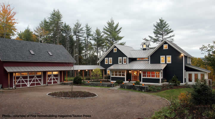 Inspiration for a large traditional two-storey green house exterior in Burlington with mixed siding, a gable roof and a metal roof.