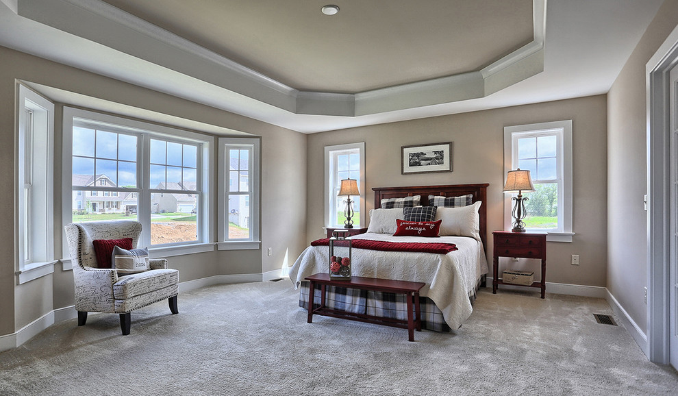 Design ideas for a large transitional master bedroom in Other with carpet, no fireplace, beige walls and brown floor.