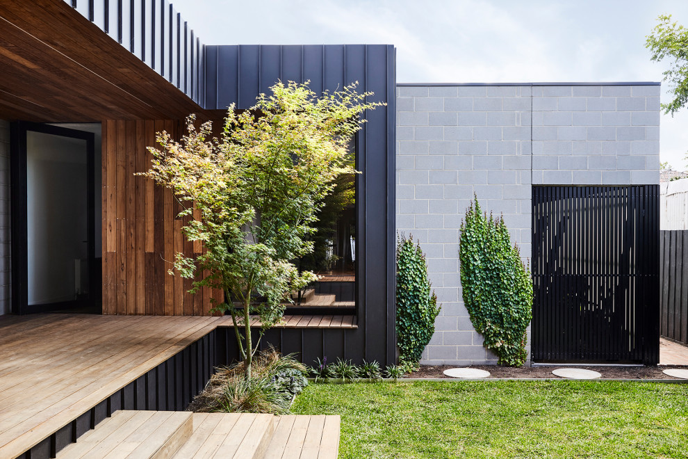 Inspiration for a mid-sized contemporary black exterior in Melbourne.