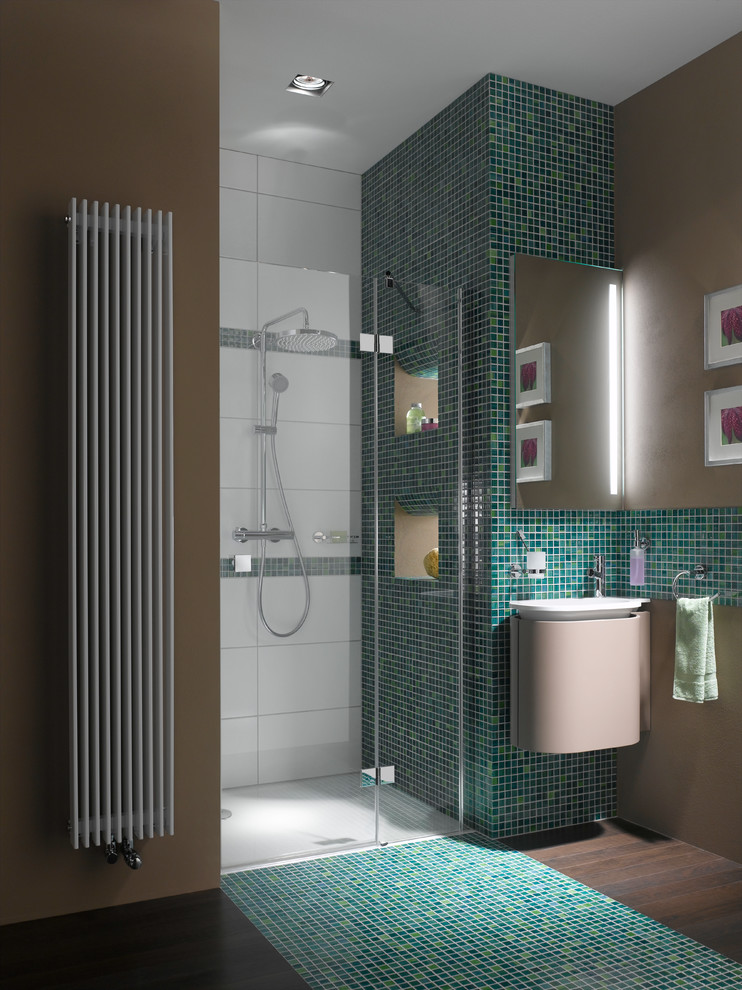 This is an example of a modern bathroom in Raleigh with an alcove shower, blue tile, mosaic tile, blue walls, mosaic tile floors and a wall-mount sink.
