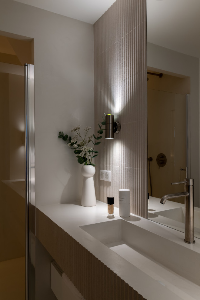 Mid-sized trendy 3/4 concrete floor, white floor and single-sink walk-in shower photo in Paris with beaded inset cabinets, white cabinets, white walls, a console sink, concrete countertops, a hinged shower door, white countertops and a built-in vanity