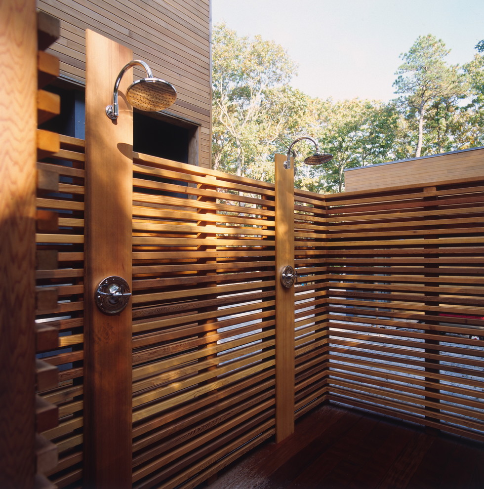 This is an example of a contemporary patio in New York with an outdoor shower.