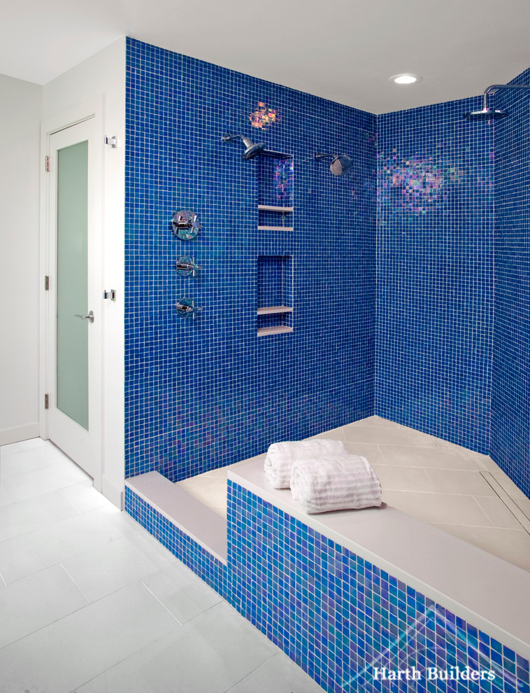Design ideas for a large eclectic master bathroom in Philadelphia with a vessel sink, flat-panel cabinets, white cabinets, engineered quartz benchtops, a freestanding tub, an open shower, a one-piece toilet, blue tile, mosaic tile, white walls and porcelain floors.
