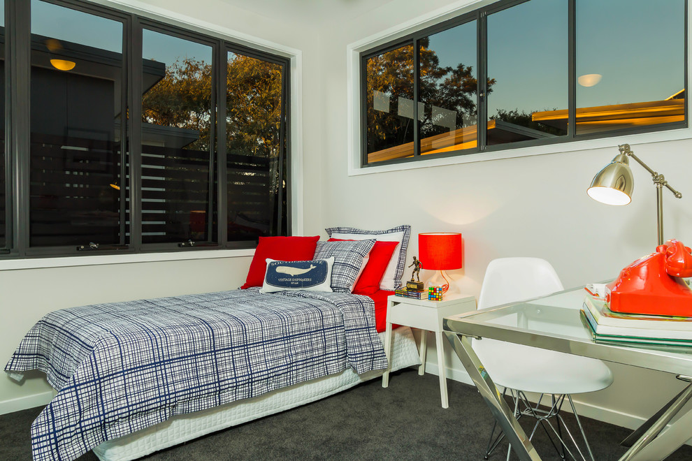 Photo of a mid-sized contemporary bedroom in Brisbane with grey walls and carpet.