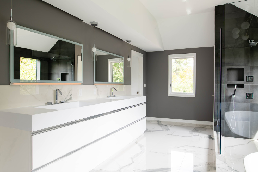 Inspiration for a large contemporary master bathroom in Boston with flat-panel cabinets, white cabinets, a freestanding tub, a double shower, gray tile, porcelain tile, dark hardwood floors, engineered quartz benchtops, white benchtops, a double vanity and a built-in vanity.
