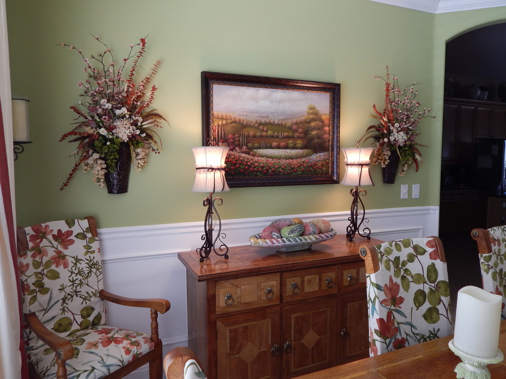 Photo of a large traditional dining room in Jacksonville with green walls.