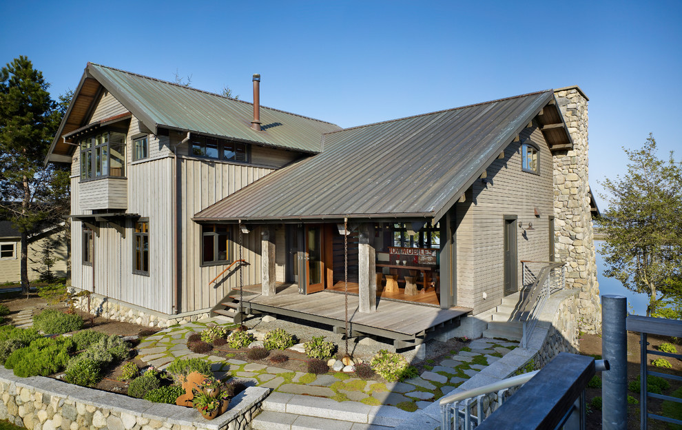 Inspiration for a country exterior in Seattle with wood siding.