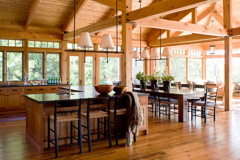 Mountain style medium tone wood floor open concept kitchen photo in Toronto with an undermount sink, medium tone wood cabinets and an island