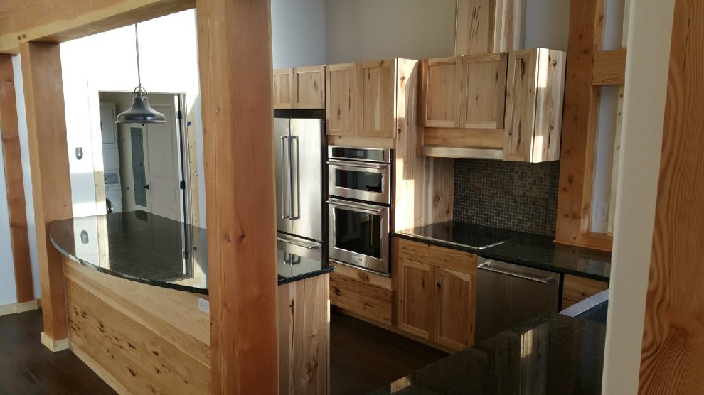 Kitchen - mid-sized rustic l-shaped dark wood floor kitchen idea in Seattle with shaker cabinets, light wood cabinets, black backsplash, stainless steel appliances and an island
