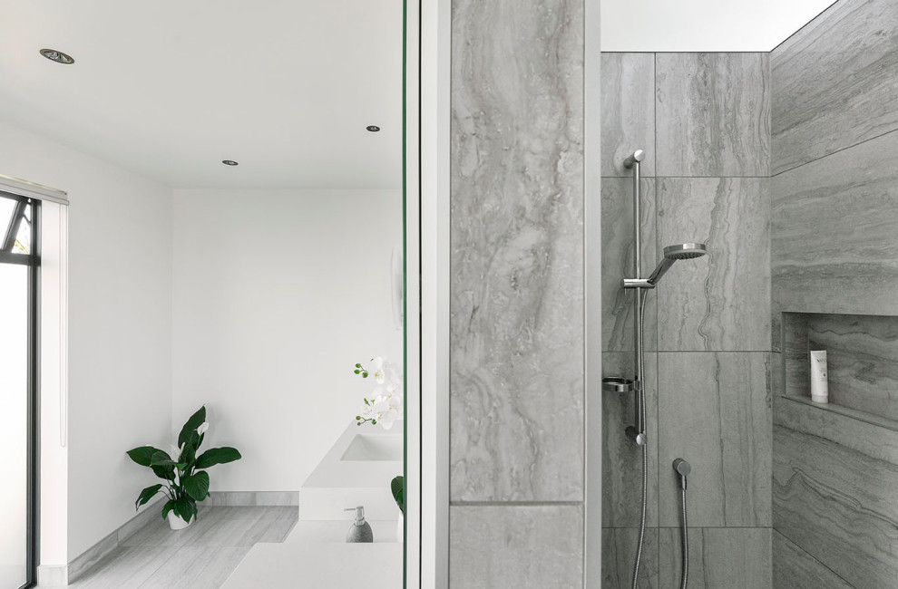Large contemporary shower room bathroom in Auckland with white cabinets, a walk-in shower, a one-piece toilet, grey tiles, marble tiles, white walls, ceramic flooring, an integrated sink, terrazzo worktops, grey floors, an open shower, white worktops, double sinks and a floating vanity unit.