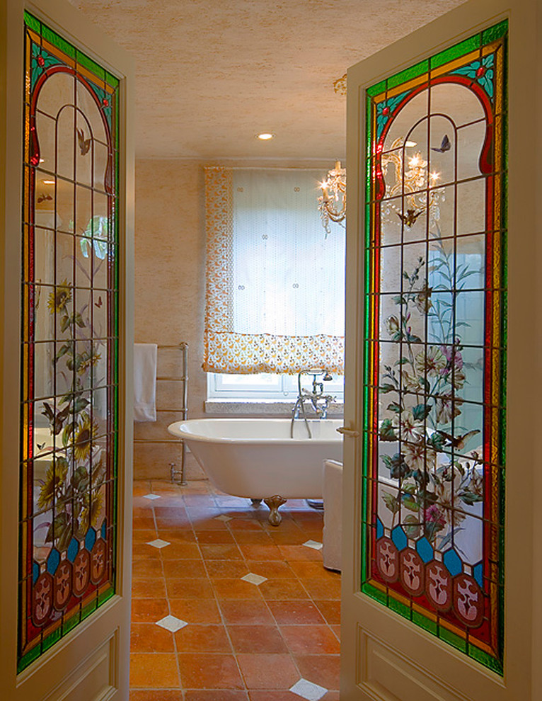 Inspiration for a traditional bathroom in Other with a claw-foot tub.